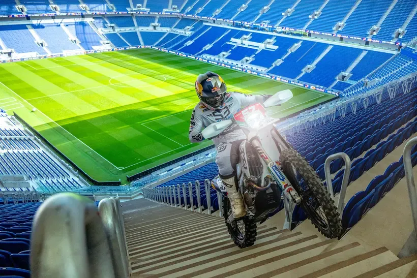 Billy Bolt riding bike up stadium walkway